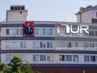 A portrait of Mustafa Kemal Ataturk hangs on the university building in Alanya, Turkey, on November 3, 2024. (