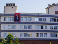 A portrait of Mustafa Kemal Ataturk hangs on the university building in Alanya, Turkey, on November 3, 2024. (