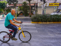 A man on a bicycle cycles in Alanya, Turkey, on November 3, 2024. (