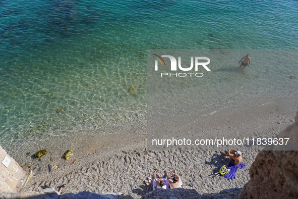 People take a dip in the warm November waters of the Mediterranean Sea in Alanya, Turkey, on November 5, 2024. 