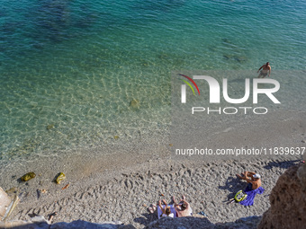 People take a dip in the warm November waters of the Mediterranean Sea in Alanya, Turkey, on November 5, 2024. (