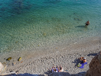 People take a dip in the warm November waters of the Mediterranean Sea in Alanya, Turkey, on November 5, 2024. (