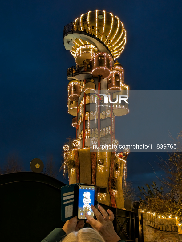 The Kuchlbauer Tower, designed by Friedensreich Hundertwasser, is illuminated for Christmas. In the historic center of Abensberg, Bavaria, G...