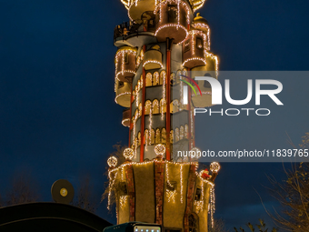 The Kuchlbauer Tower, designed by Friedensreich Hundertwasser, is illuminated for Christmas. In the historic center of Abensberg, Bavaria, G...