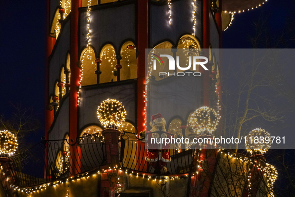 The Kuchlbauer Tower, designed by Friedensreich Hundertwasser, is illuminated for Christmas. In the historic center of Abensberg, Bavaria, G...