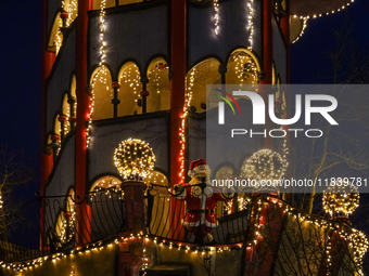 The Kuchlbauer Tower, designed by Friedensreich Hundertwasser, is illuminated for Christmas. In the historic center of Abensberg, Bavaria, G...