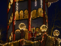 The Kuchlbauer Tower, designed by Friedensreich Hundertwasser, is illuminated for Christmas. In the historic center of Abensberg, Bavaria, G...