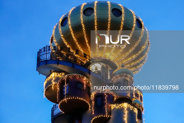 The Kuchlbauer Tower, designed by Friedensreich Hundertwasser, is illuminated for Christmas. In the historic center of Abensberg, Bavaria, G...