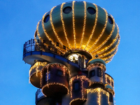 The Kuchlbauer Tower, designed by Friedensreich Hundertwasser, is illuminated for Christmas. In the historic center of Abensberg, Bavaria, G...