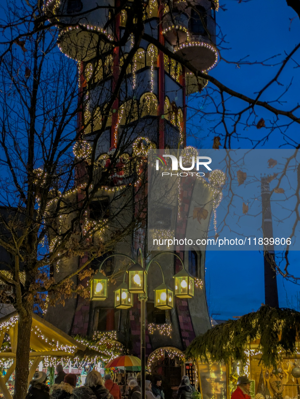 The Kuchlbauer Tower, designed by Friedensreich Hundertwasser, is illuminated for Christmas. In the historic center of Abensberg, Bavaria, G...