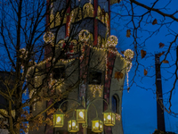 The Kuchlbauer Tower, designed by Friedensreich Hundertwasser, is illuminated for Christmas. In the historic center of Abensberg, Bavaria, G...