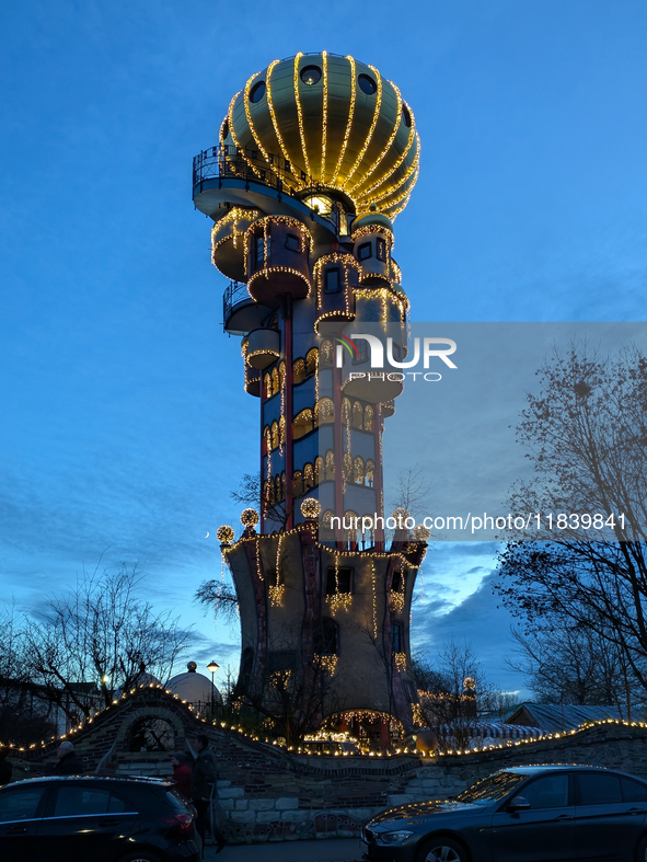 The Kuchlbauer Tower, designed by Friedensreich Hundertwasser, is illuminated for Christmas. In the historic center of Abensberg, Bavaria, G...