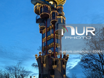 The Kuchlbauer Tower, designed by Friedensreich Hundertwasser, is illuminated for Christmas. In the historic center of Abensberg, Bavaria, G...