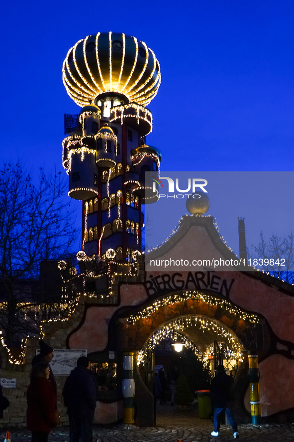 The Kuchlbauer Tower, designed by Friedensreich Hundertwasser, is illuminated for Christmas. In the historic center of Abensberg, Bavaria, G...