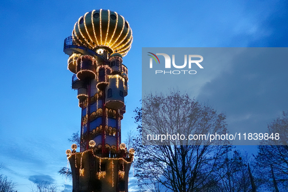 The Kuchlbauer Tower, designed by Friedensreich Hundertwasser, is illuminated for Christmas. In the historic center of Abensberg, Bavaria, G...