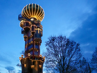 The Kuchlbauer Tower, designed by Friedensreich Hundertwasser, is illuminated for Christmas. In the historic center of Abensberg, Bavaria, G...