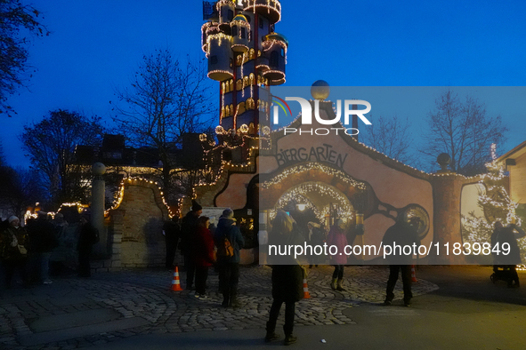 The Kuchlbauer Tower, designed by Friedensreich Hundertwasser, is illuminated for Christmas. In the historic center of Abensberg, Bavaria, G...