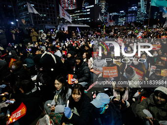 Thousands of citizens gather across from the National Assembly to demand the impeachment of President Yoon Suk-yeol in Seoul, South Korea, o...