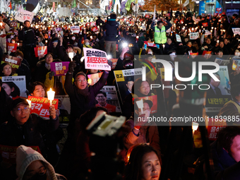 Thousands of citizens gather across from the National Assembly to demand the impeachment of President Yoon Suk-yeol in Seoul, South Korea, o...