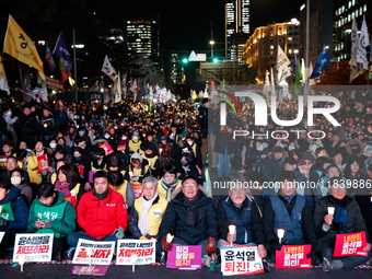 Thousands of citizens gather across from the National Assembly to demand the impeachment of President Yoon Suk-yeol in Seoul, South Korea, o...