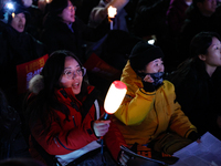 Thousands of citizens gather across from the National Assembly to demand the impeachment of President Yoon Suk-yeol in Seoul, South Korea, o...