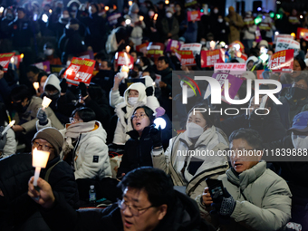 Thousands of citizens gather across from the National Assembly to demand the impeachment of President Yoon Suk-yeol in Seoul, South Korea, o...