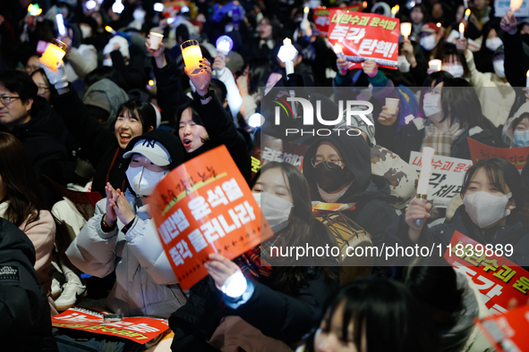 Thousands of citizens gather across from the National Assembly to demand the impeachment of President Yoon Suk-yeol in Seoul, South Korea, o...