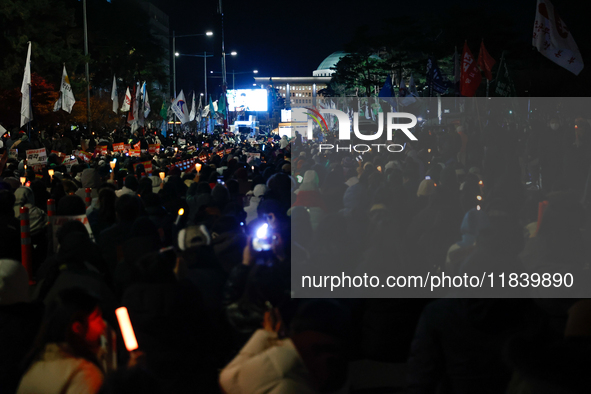 Thousands of citizens gather across from the National Assembly to demand the impeachment of President Yoon Suk-yeol in Seoul, South Korea, o...