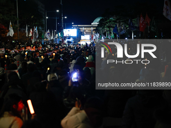 Thousands of citizens gather across from the National Assembly to demand the impeachment of President Yoon Suk-yeol in Seoul, South Korea, o...