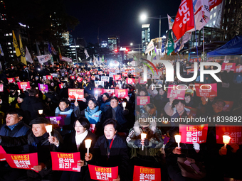 Thousands of citizens gather across from the National Assembly to demand the impeachment of President Yoon Suk-yeol in Seoul, South Korea, o...