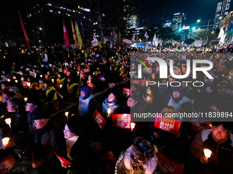 Thousands of citizens gather across from the National Assembly to demand the impeachment of President Yoon Suk-yeol in Seoul, South Korea, o...