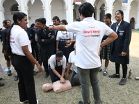 A medical official demonstrates lifesaving Cardiopulmonary Resuscitation (CPR) on a mannequin with breathing problems during a CPR training...