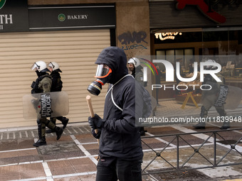 People protest in Athens, Greece, on December 6, 2024, marking the 16th anniversary of the death of 15-year-old Alexis Grigoropoulos, who is...