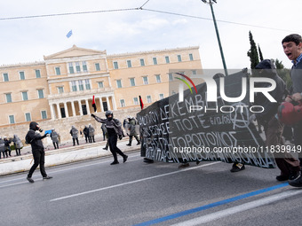 People protest in Athens, Greece, on December 6, 2024, marking the 16th anniversary of the death of 15-year-old Alexis Grigoropoulos, who is...