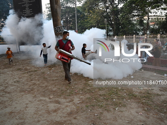 An Employee Of Dhaka South City Corporation Sprays Pesticide For Kill Mosquitoes In Dhaka, Bangladesh On December 6, 2024. Since January 1,...