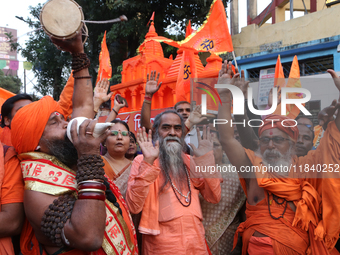 Hindu monks and members of Hindu Jagaran Monch hold a protest against the recent arrest of ISKCON Bangladesh priest Chinmoy Krishna Das by D...