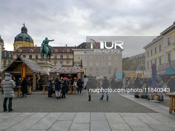 Visitors experience the festive atmosphere of the Medieval Christmas Market in Munich, Bavaria, Germany, on December 6, 2024. The market, lo...