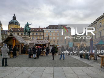 Visitors experience the festive atmosphere of the Medieval Christmas Market in Munich, Bavaria, Germany, on December 6, 2024. The market, lo...