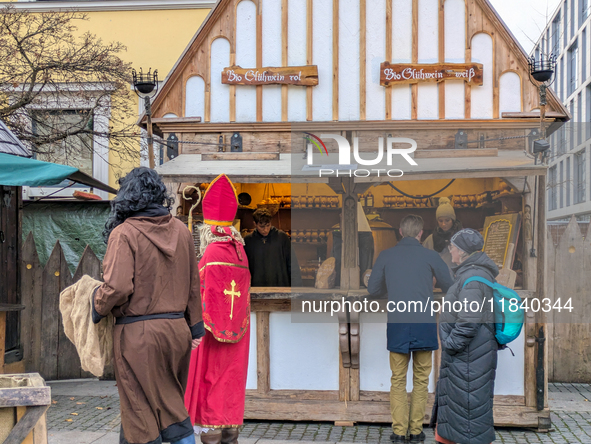 Visitors experience the festive atmosphere of the Medieval Christmas Market in Munich, Bavaria, Germany, on December 6, 2024. The market, lo...