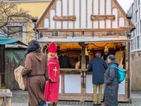 Visitors experience the festive atmosphere of the Medieval Christmas Market in Munich, Bavaria, Germany, on December 6, 2024. The market, lo...