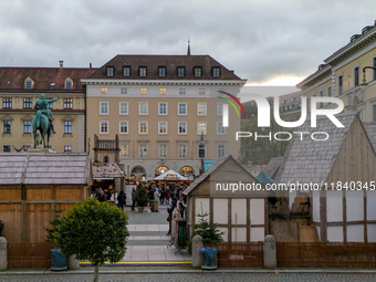 Visitors experience the festive atmosphere of the Medieval Christmas Market in Munich, Bavaria, Germany, on December 6, 2024. The market, lo...