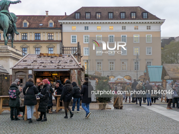 Visitors experience the festive atmosphere of the Medieval Christmas Market in Munich, Bavaria, Germany, on December 6, 2024. The market, lo...