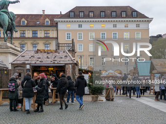 Visitors experience the festive atmosphere of the Medieval Christmas Market in Munich, Bavaria, Germany, on December 6, 2024. The market, lo...