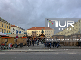 Visitors experience the festive atmosphere of the Medieval Christmas Market in Munich, Bavaria, Germany, on December 6, 2024. The market, lo...