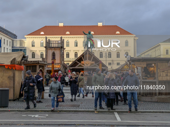 Visitors experience the festive atmosphere of the Medieval Christmas Market in Munich, Bavaria, Germany, on December 6, 2024. The market, lo...