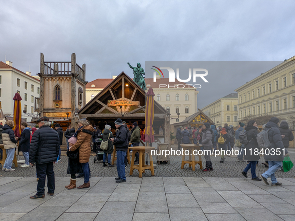 Visitors experience the festive atmosphere of the Medieval Christmas Market in Munich, Bavaria, Germany, on December 6, 2024. The market, lo...