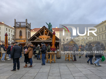 Visitors experience the festive atmosphere of the Medieval Christmas Market in Munich, Bavaria, Germany, on December 6, 2024. The market, lo...