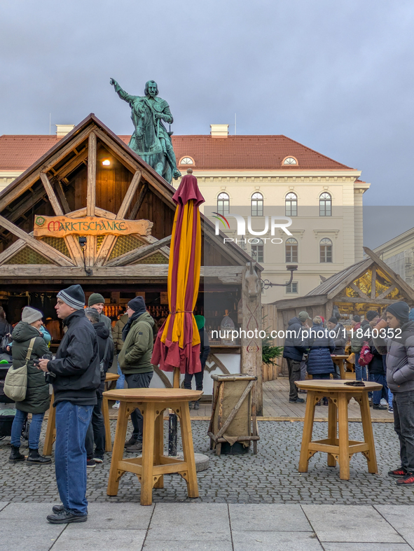 Visitors experience the festive atmosphere of the Medieval Christmas Market in Munich, Bavaria, Germany, on December 6, 2024. The market, lo...