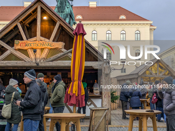 Visitors experience the festive atmosphere of the Medieval Christmas Market in Munich, Bavaria, Germany, on December 6, 2024. The market, lo...