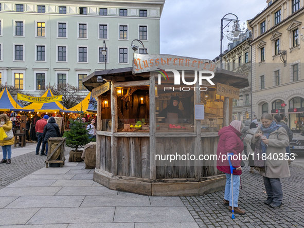 Visitors experience the festive atmosphere of the Medieval Christmas Market in Munich, Bavaria, Germany, on December 6, 2024. The market, lo...